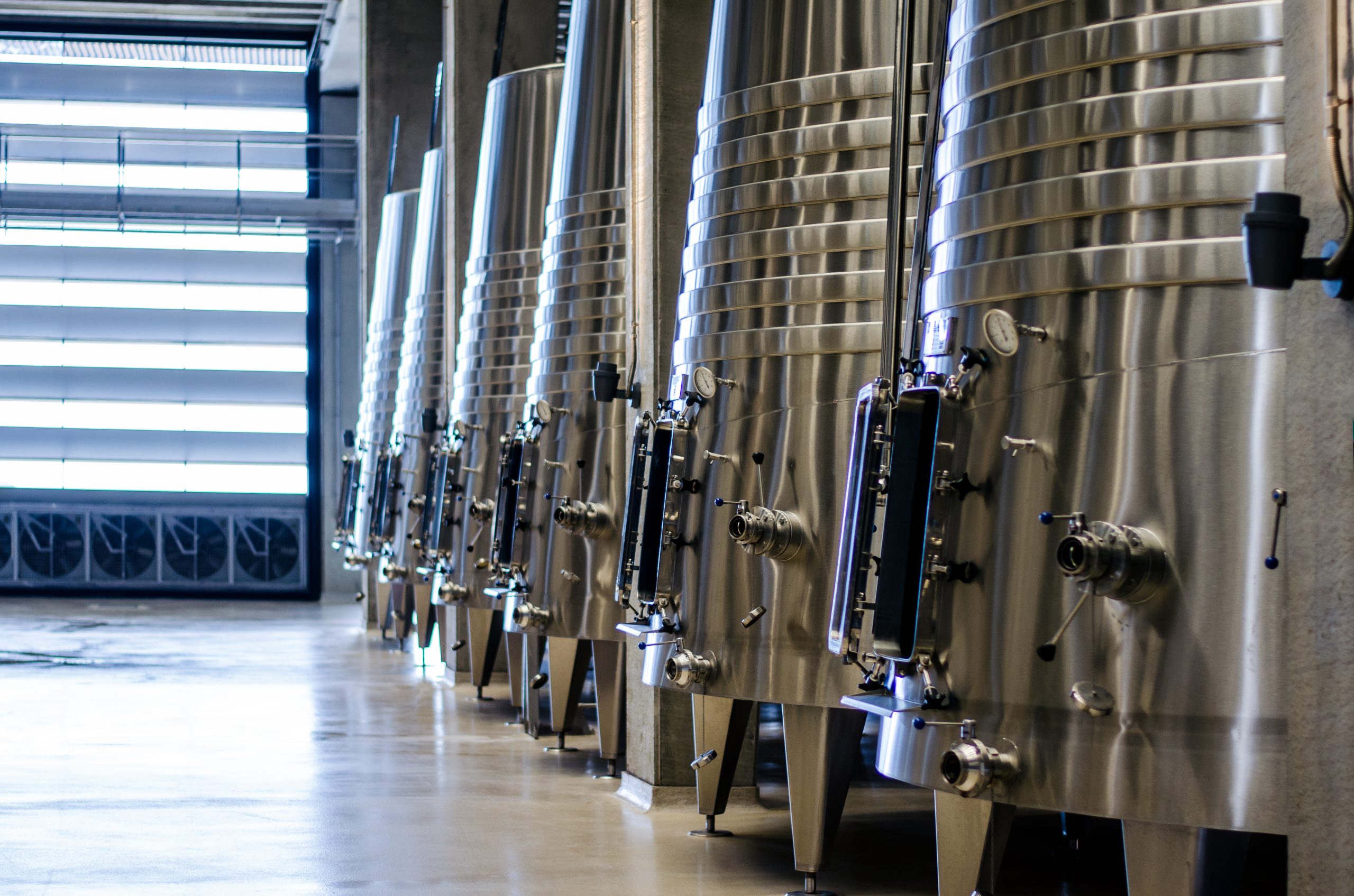 Modern winery with big steel barrels Modern winery with big steel barrels